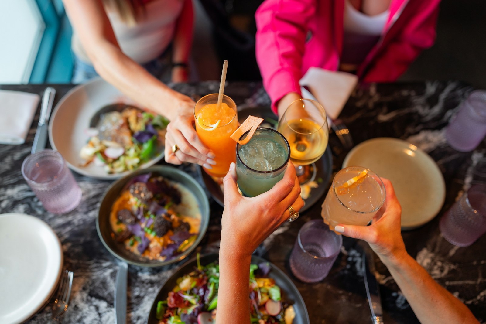 Housemates relaxing together in a shared co-living kitchen