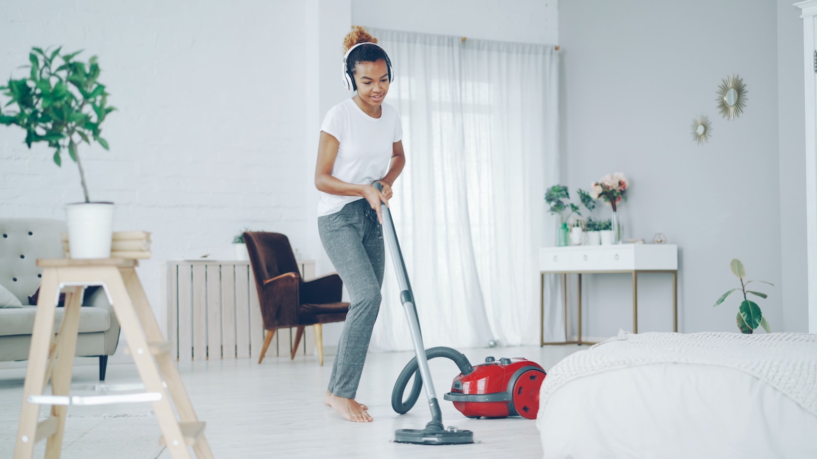 Professional cleaner working in a communal kitchen